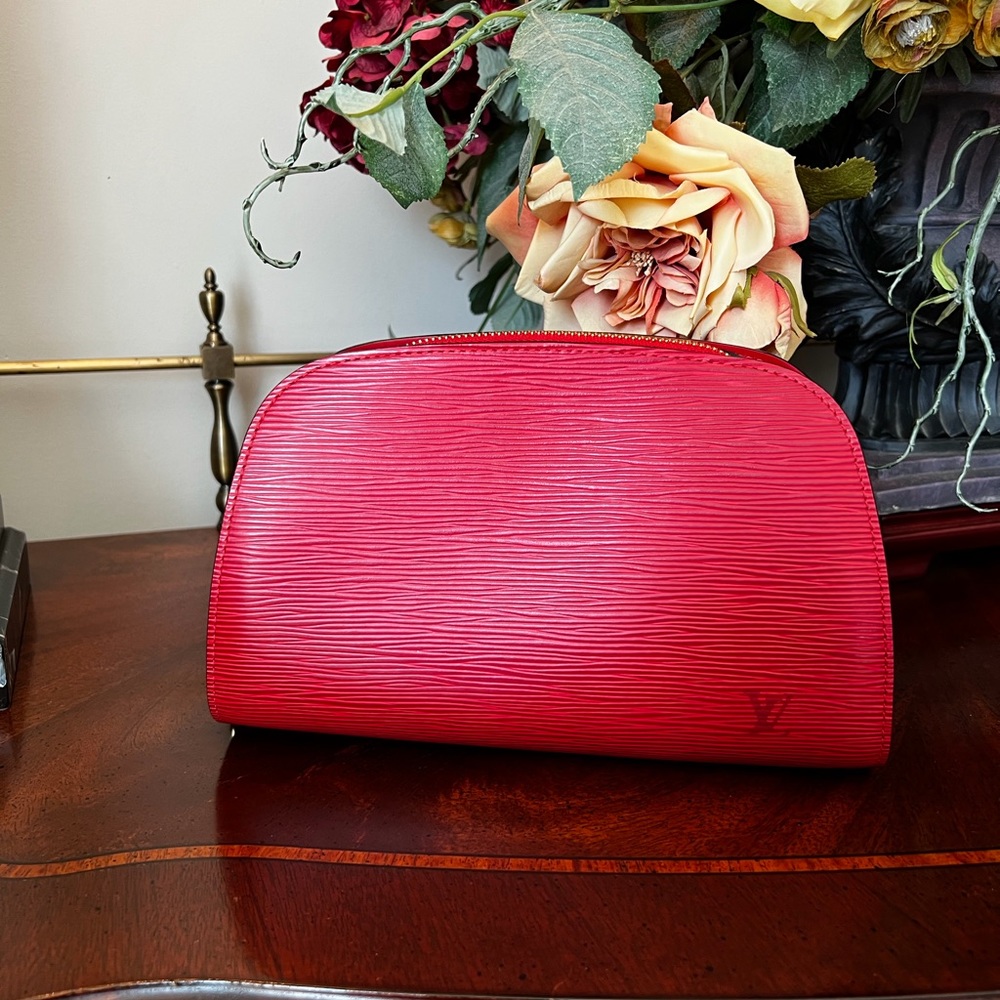 Like New … Authentic Louis Vuitton Red Dauphin Epi Leather with Gold Hardware.